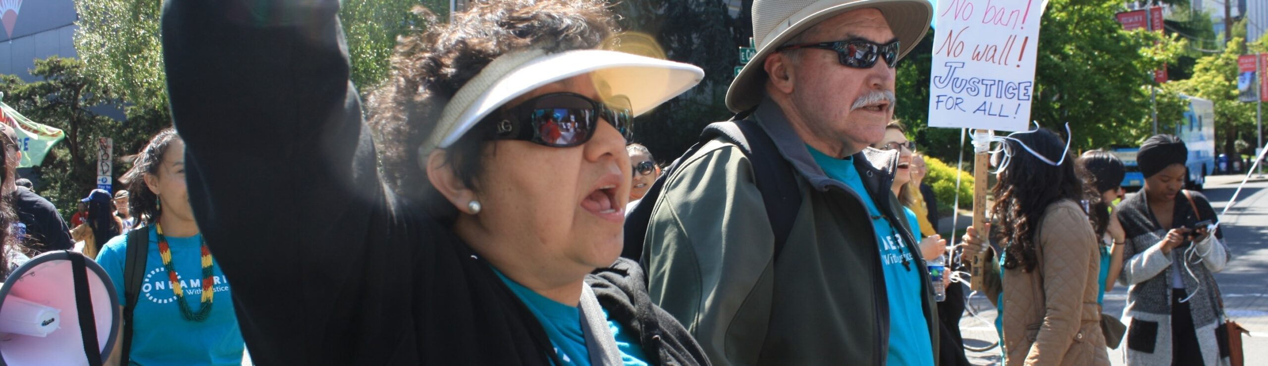Two adults march in a protest